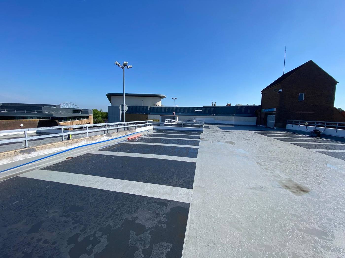 Resurfaced car park top deck with fresh bay markings